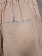 Pantaloni a vita elastica con coulisse e pieghe frontali