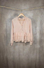 Camicetta rosa cipria con balze