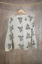 Camicia con ricami floreali neri