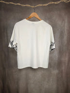 Camicia con ricami floreali