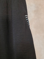 Gonna midi nera con tasche laterali
