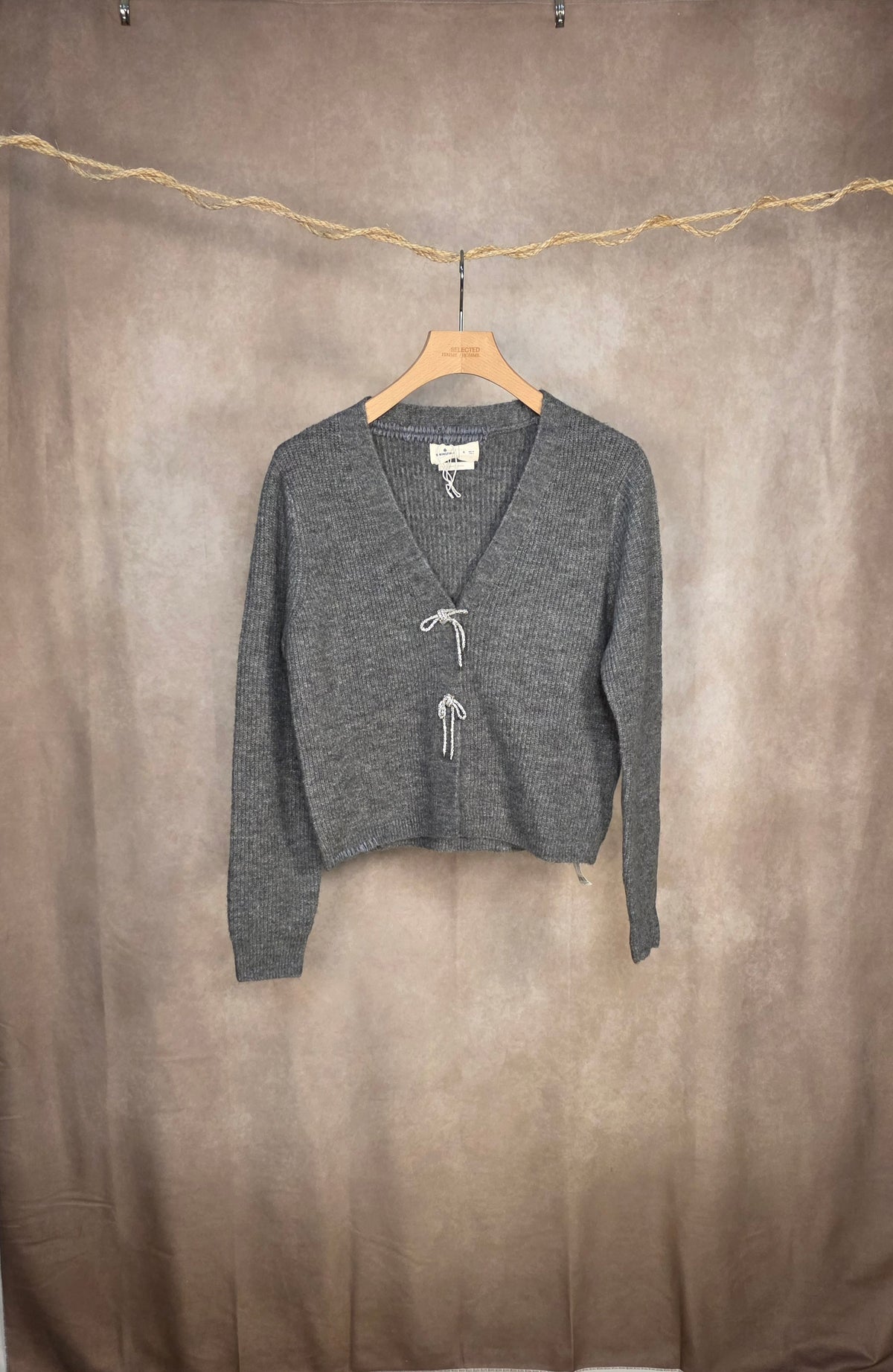 Cardigan in maglia con fiocchi