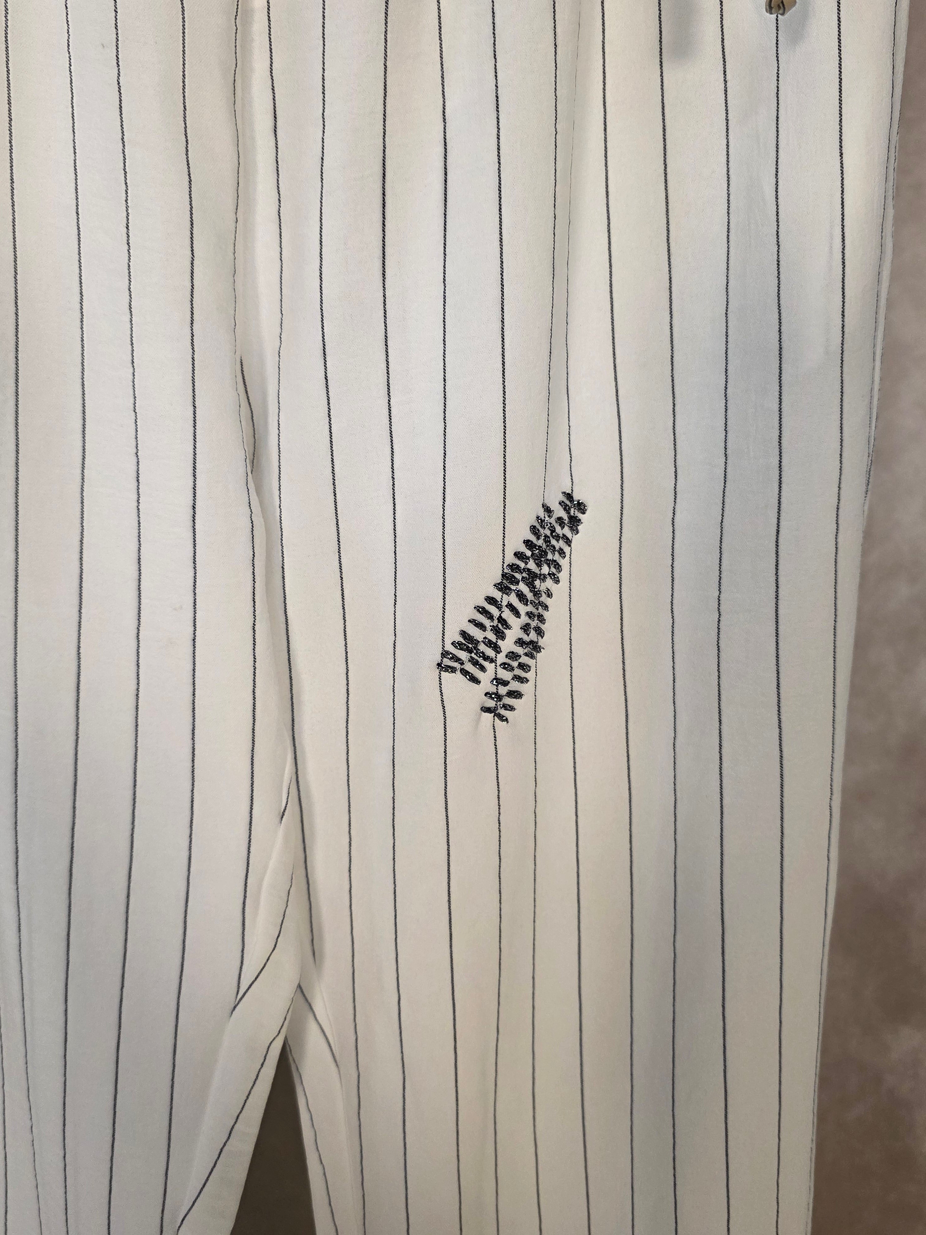 Pantaloni gessati con cinturino