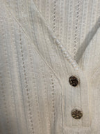 Top in maglia traforata color crema