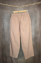 Pantaloni a vita elastica con coulisse e pieghe frontali